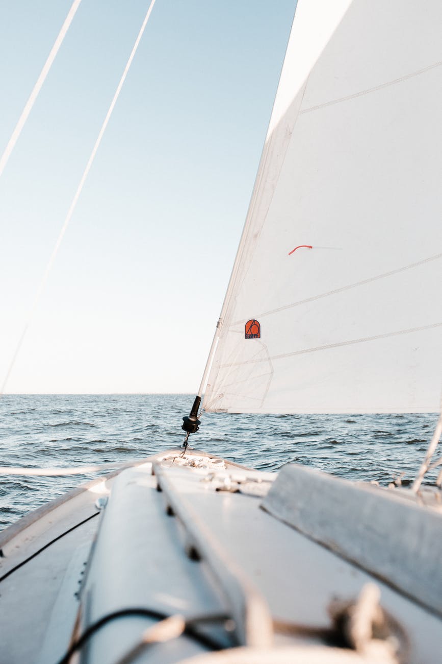photo of sailboat on sea during daytime